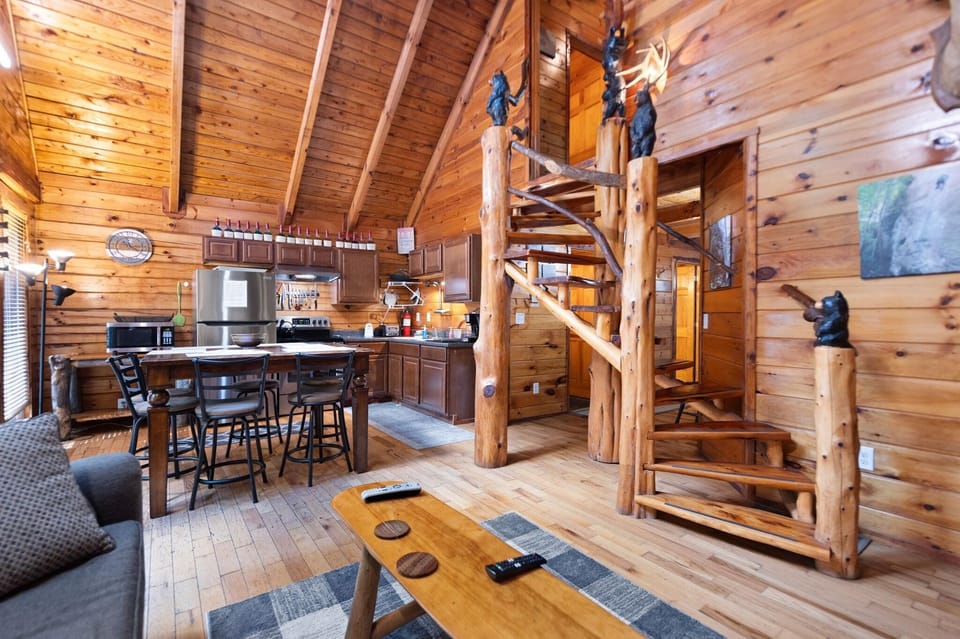 Cozy cabin living room with rustic charm and open kitchen