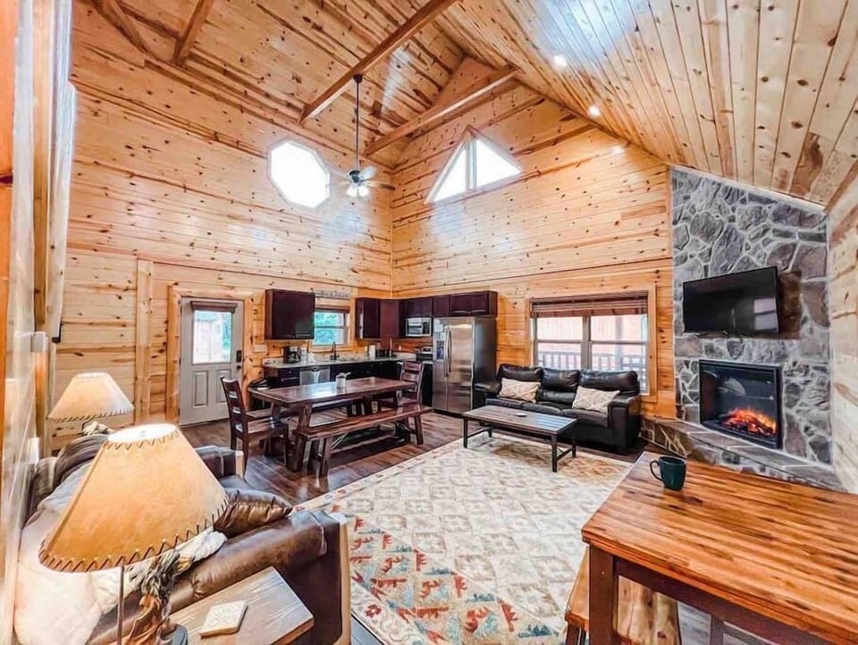open floor concept living, dining and kitchen w/ electric fireplace