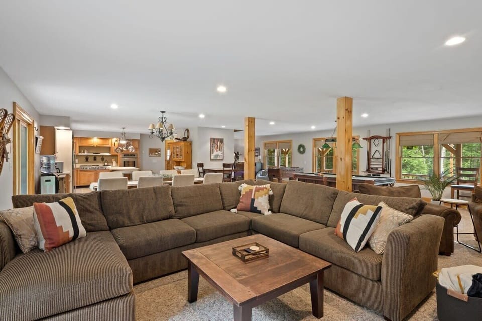 Spacious first floor with pool table, foosball, couches, wet bar, dining room and kitchen!