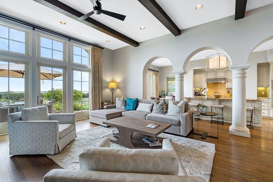 Interior of your estate features an open-floor plan and beautiful arches