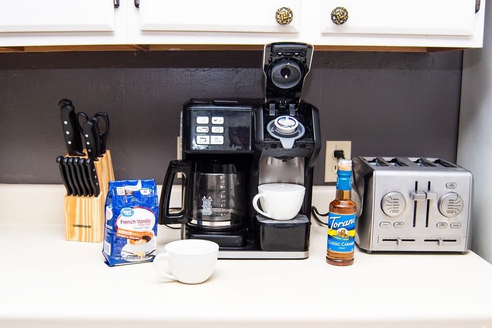 Kitchen includes oven, microwave, coffee pot (brew & k-cup).  No dishwasher.