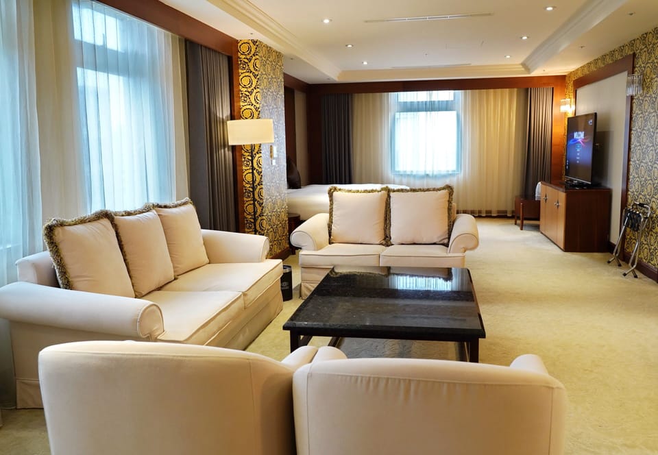 Premium Room | Living area | 50-inch LCD TV with digital channels, TV