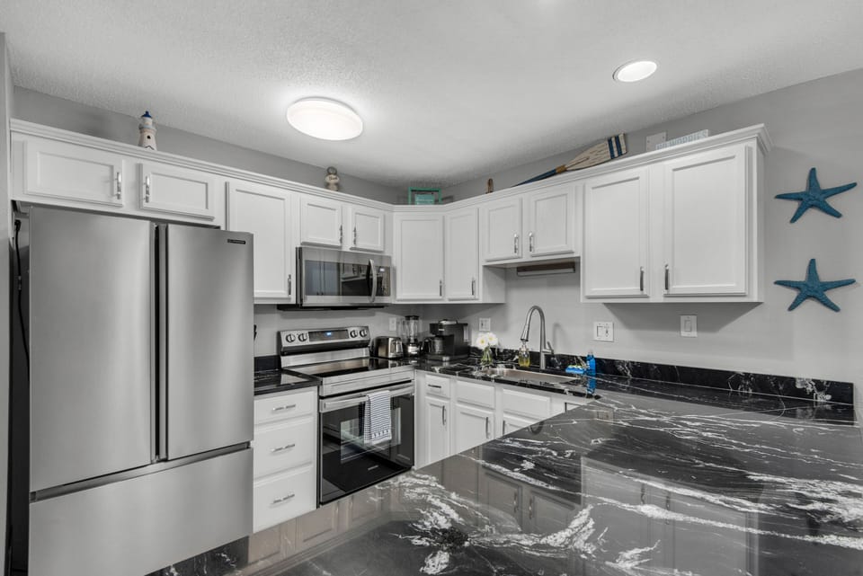 Stainless Steel appliances, fully stocked kitchen, & plenty of countertop space