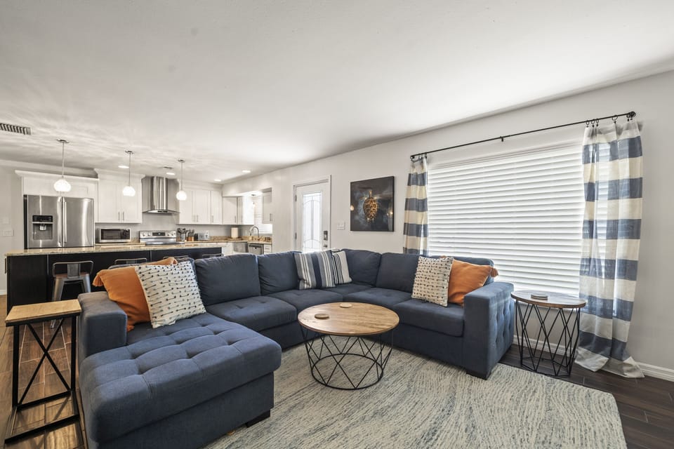 Open floor plan with kitchen open to family room, dining room and sunroom.