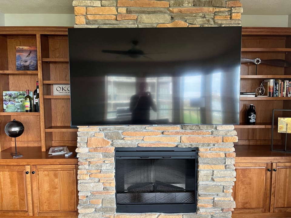When you want to curl up on the couch, there is a 75" Samsung smart TV