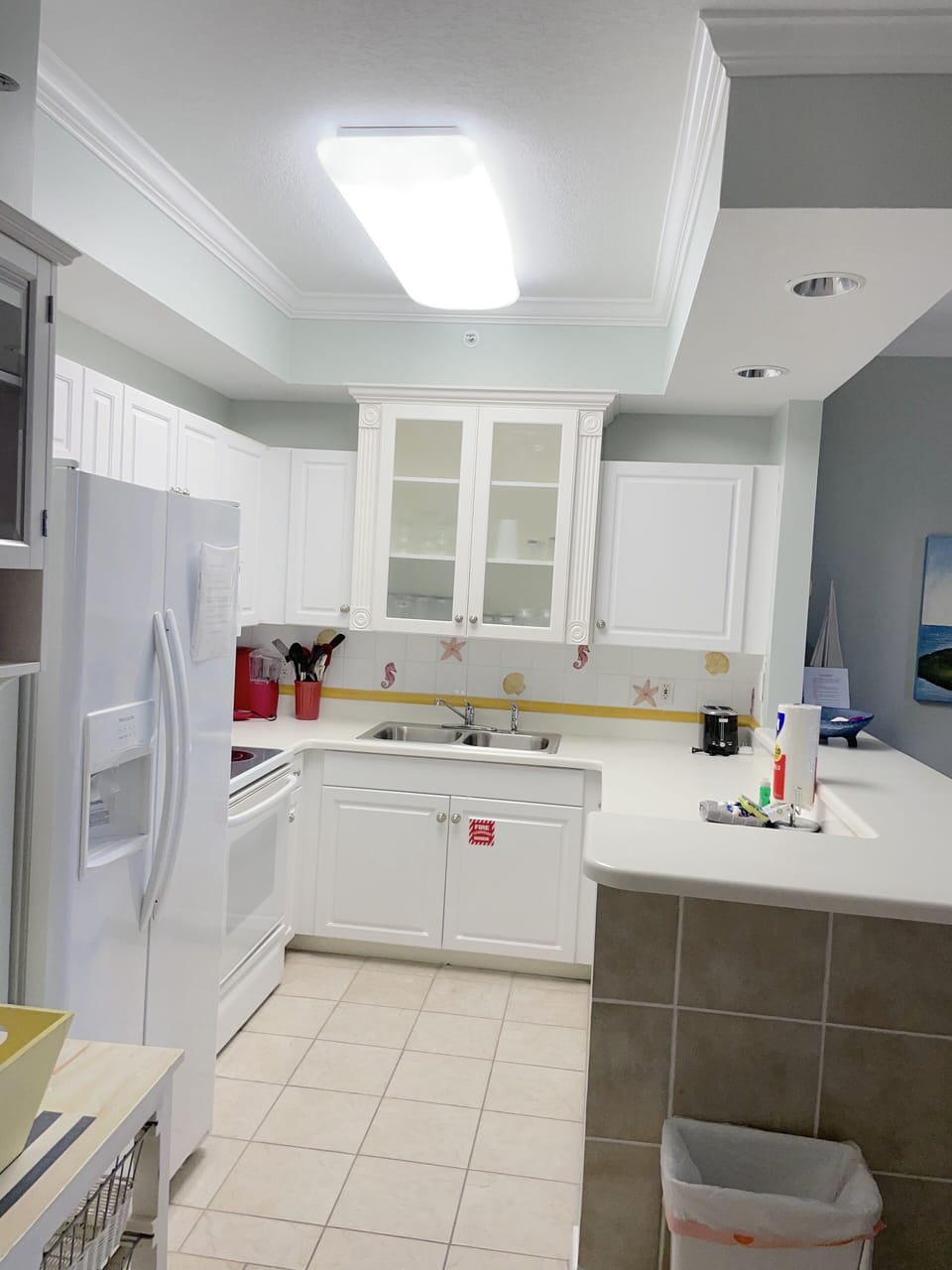 kitchen with lots of gadgets including Keurig and regular coffee machine