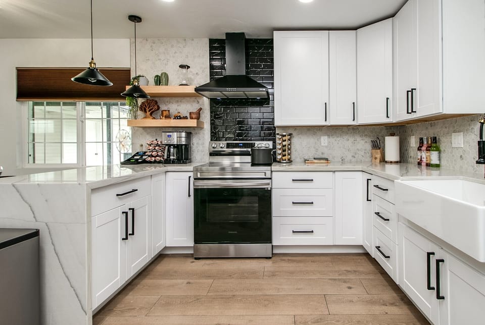 Kitchen with Pots, pans, toaster, blender, beadmaker, waffle maker, coffee maker
