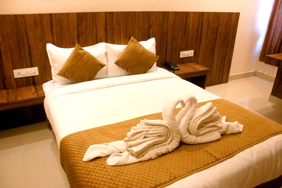 Premium bedding, desk, laptop workspace, blackout drapes