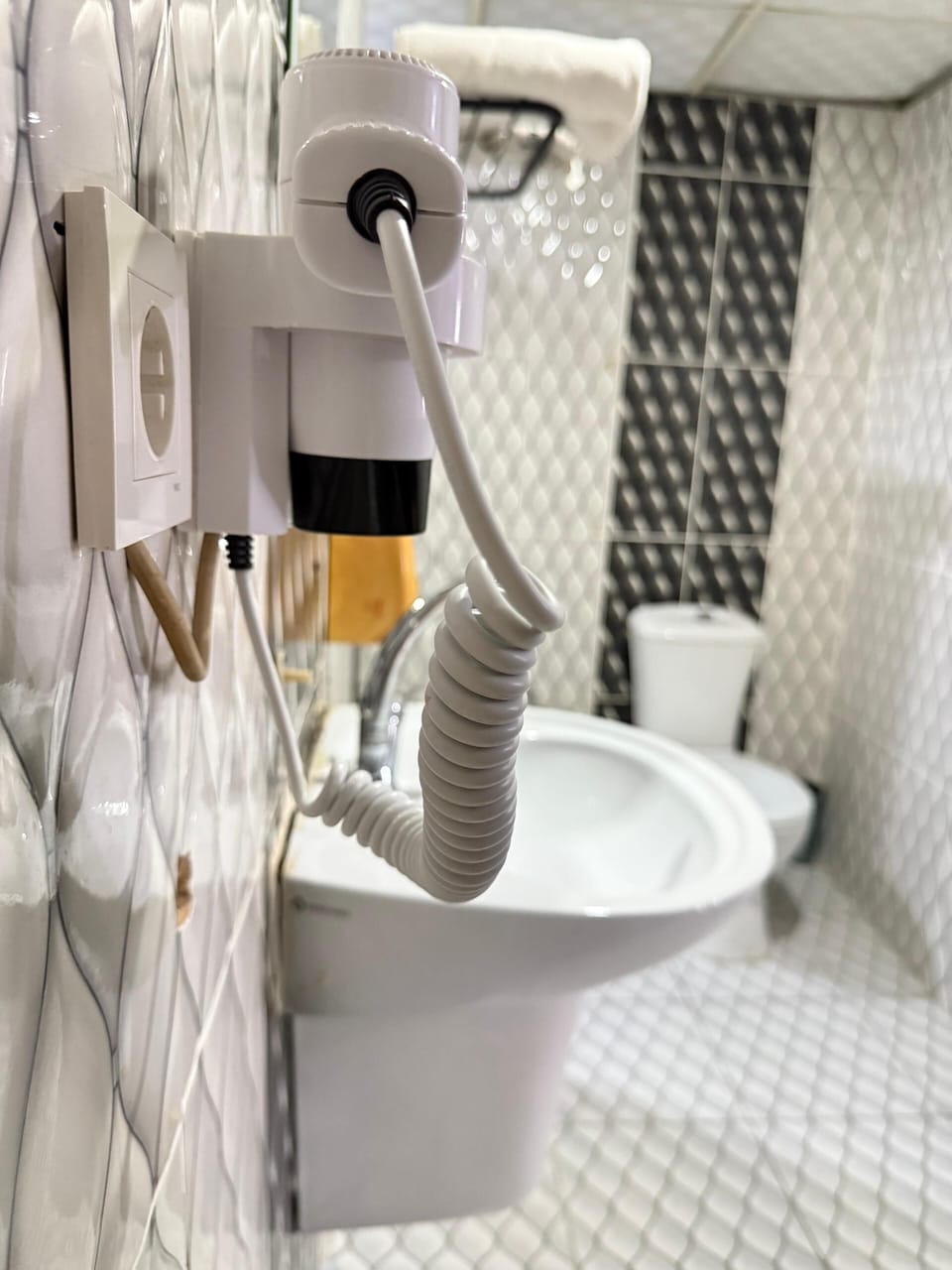 Shower, hair dryer, slippers, towels