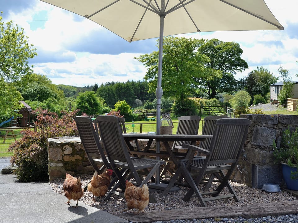 Sitting-out-area | Coastal Wood Holidays - Granary Barn, Marros, nr. Amroth