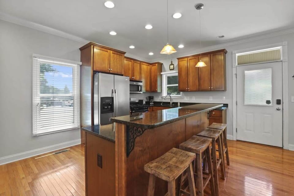 Cherry wood cabinetry and a center island — entertaining has never been easier