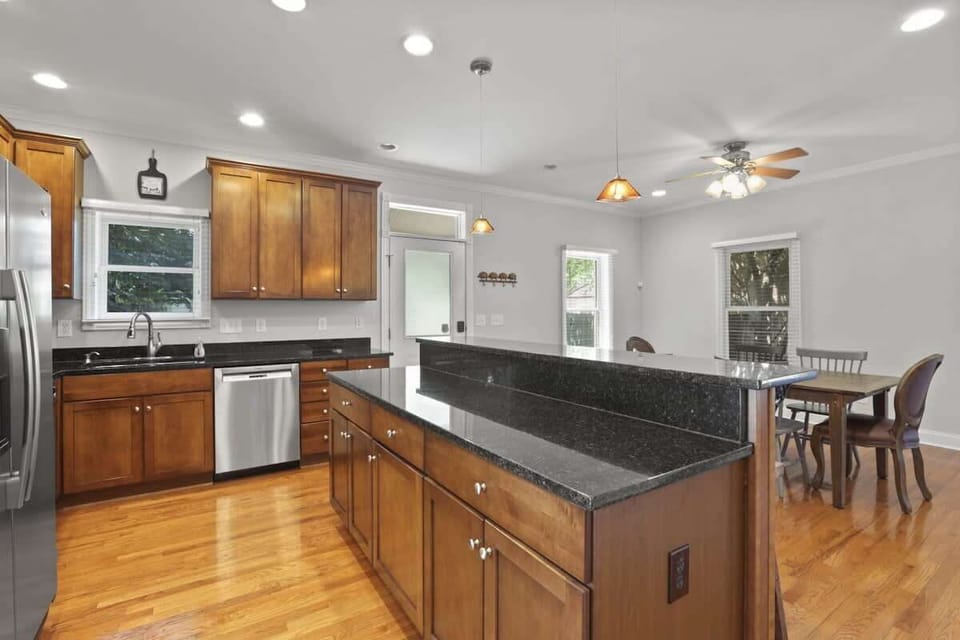 Warm cherry cabinetry, granite counters, and a layout built for real cooking
