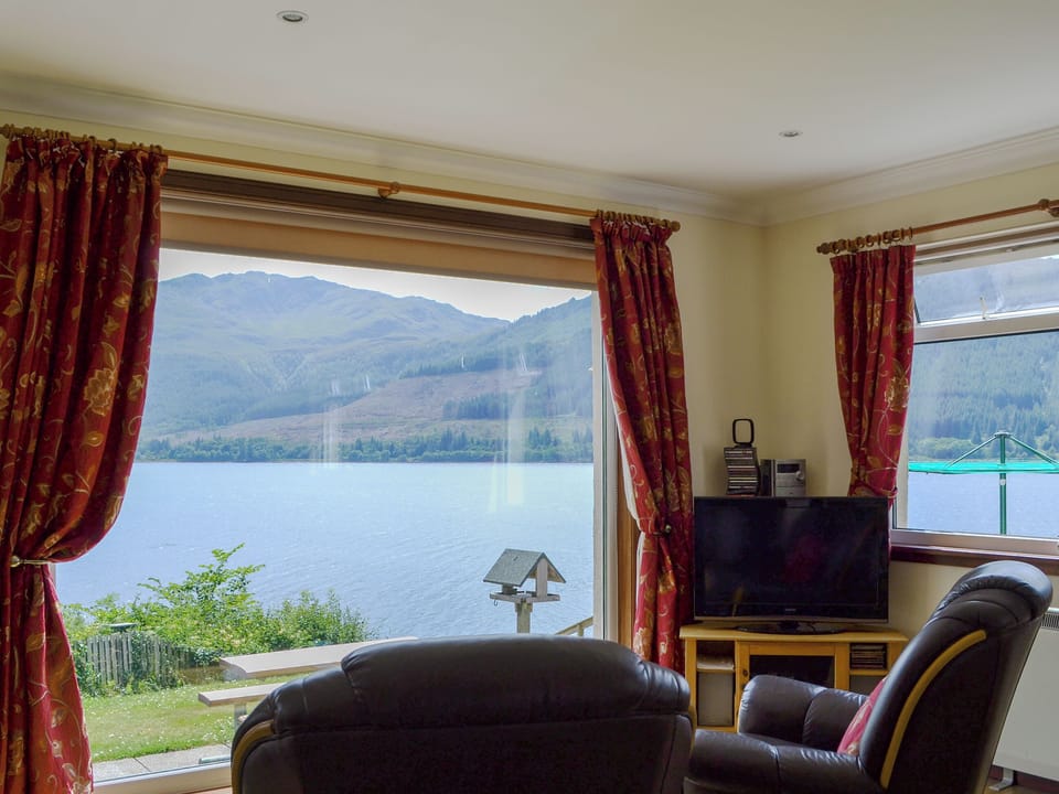 Stunning views of the Loch from the living area | Shoreside - Mullardoch Cottages, by Inverinate, Kyle