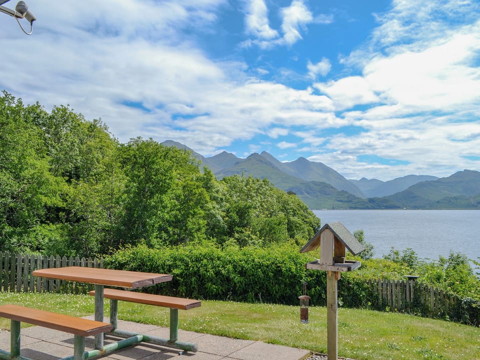 Delightful garden with sitting out area | Shoreside - Mullardoch Cottages, by Inverinate, Kyle