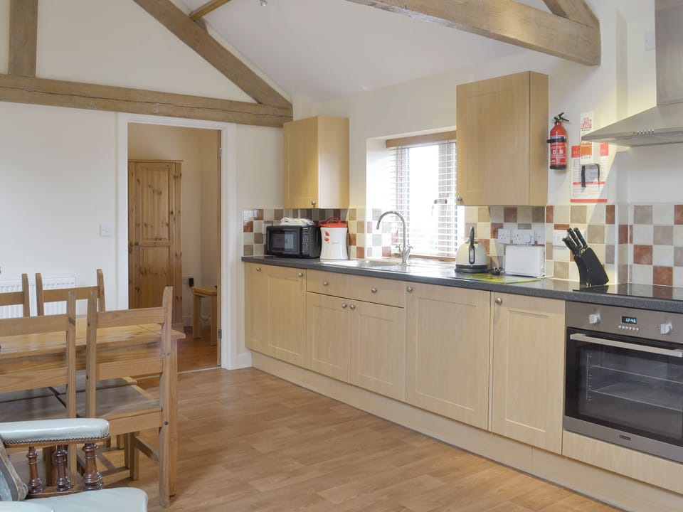Well-equipped fitted kitchen | Dairy Cottage - Harris Croft Farm, Binknoll, near Royal Wootton Bassett