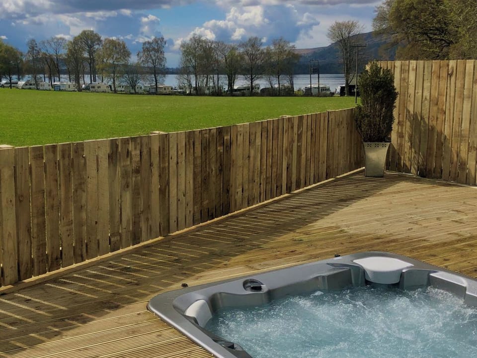 Views to the lake from the hot tub area | Clarinnes Cottage, Rowardennan, near Loch Lomond