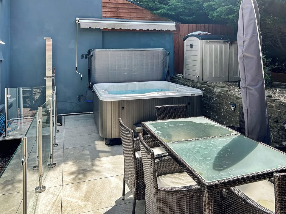 Outdoor area with Jacuzzi hot tub | Honeycott, Llangattock, near Crickhowell