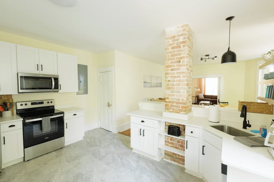 Spacious kitchen with modern appliances, essentials.