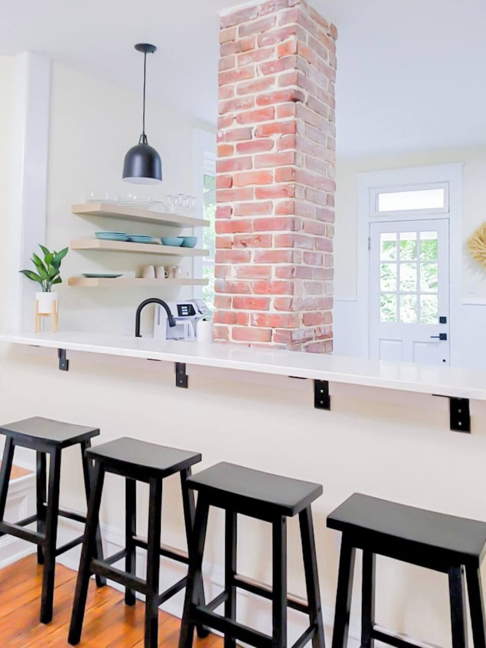 Breakfast bar with four stools.
