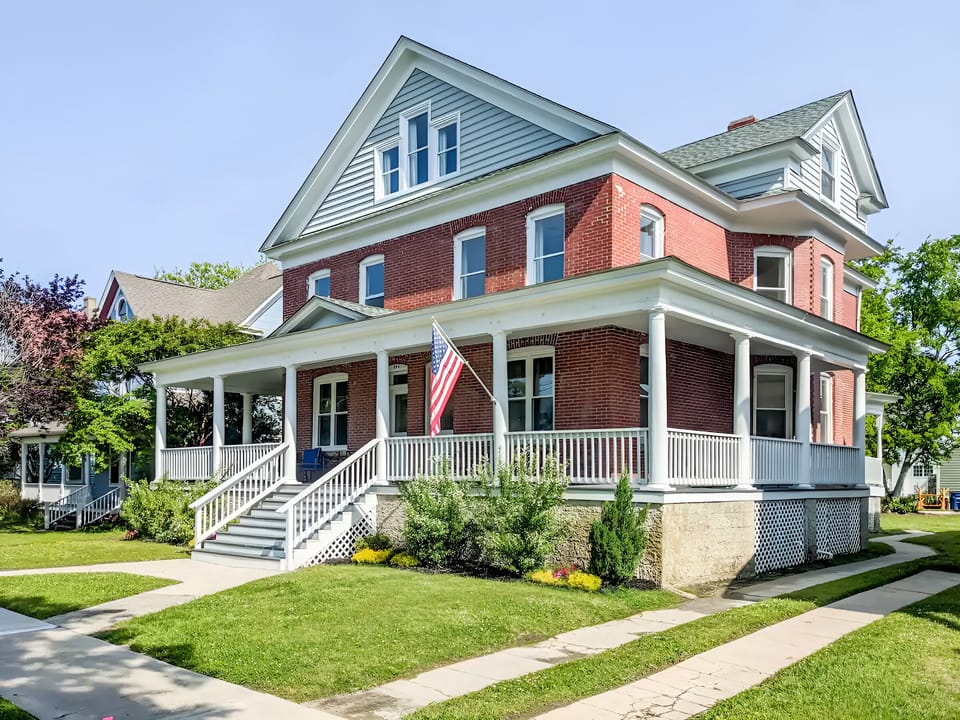 Guests can enjoy the large wrap around porch and its lounge furniture.