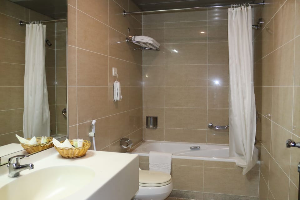 Standard Double or Twin Room | Bathroom | Combined shower/tub, hair dryer, slippers, towels