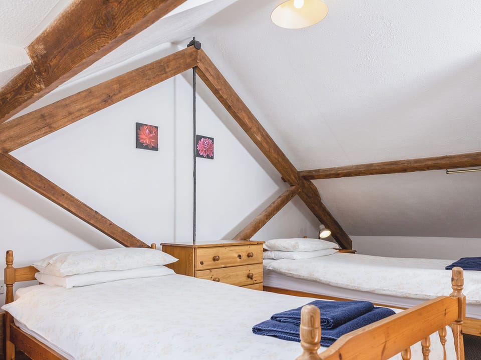 Comfortable twin bedroom | Old Nog Cottage - Stowford Lodge Holiday Cottages, Langtree, near Great Torrington