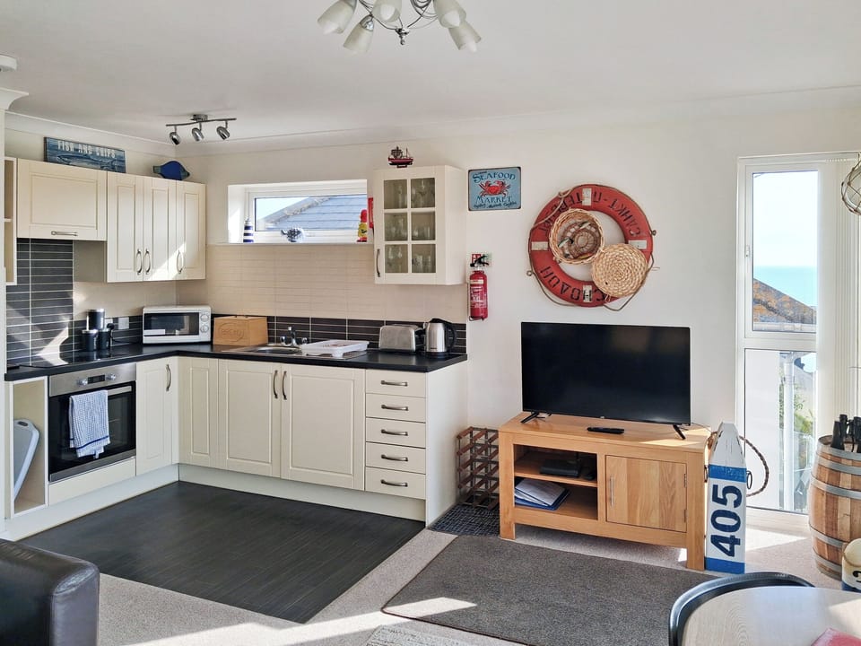 A light and airy lounge area to enjoy. | Upper Deck - Linden Court Apartments, Brixham