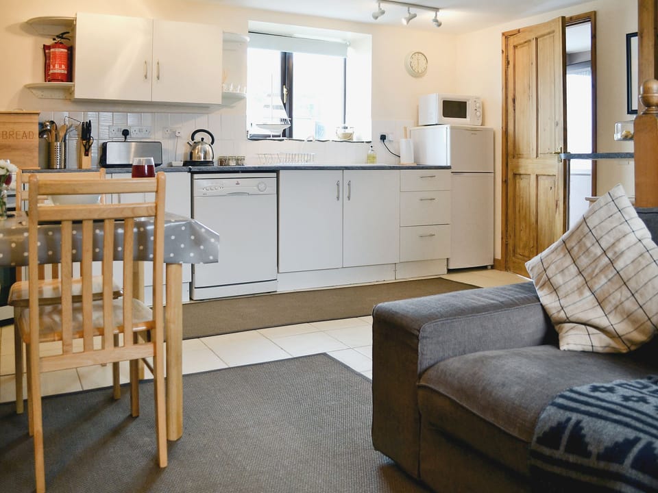 Open plan living/dining room/kitchen | Coastal Wood Holidays - Keeper&rsquo;s Cottage, Marros, nr. Amroth