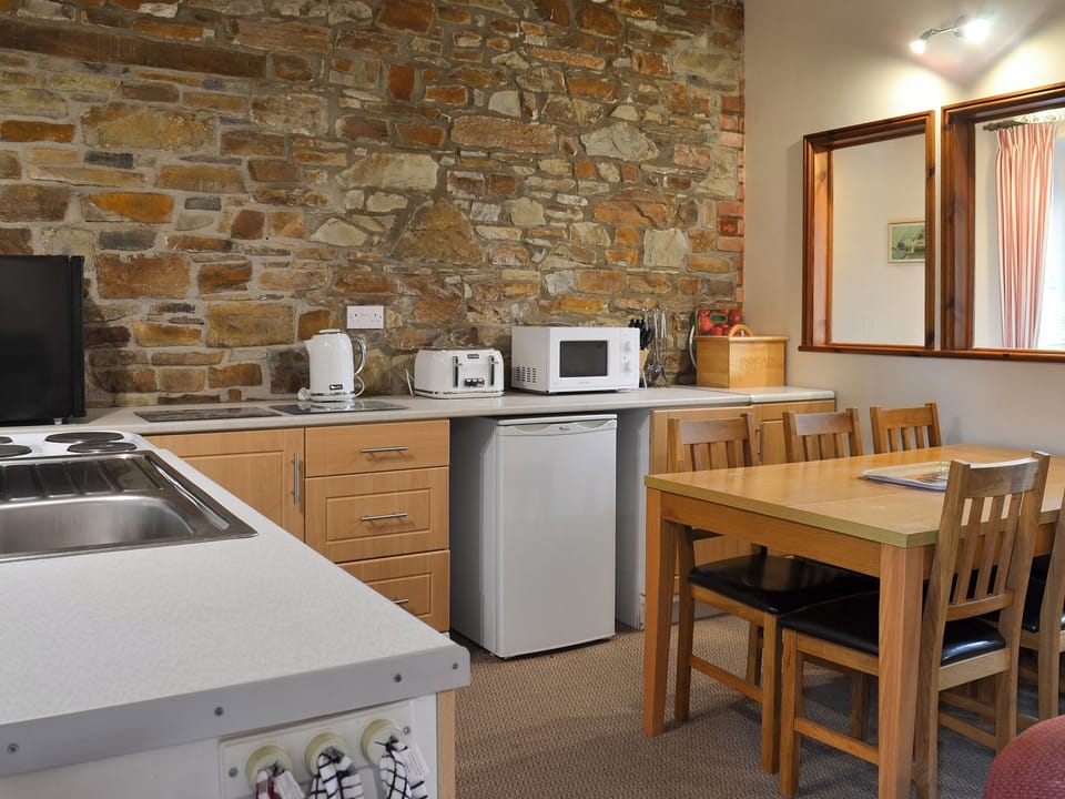 Well-equipped fitted kitchen | Warren Cottage - Stowford Lodge Holiday Cottages, Langtree, near Great Torrington