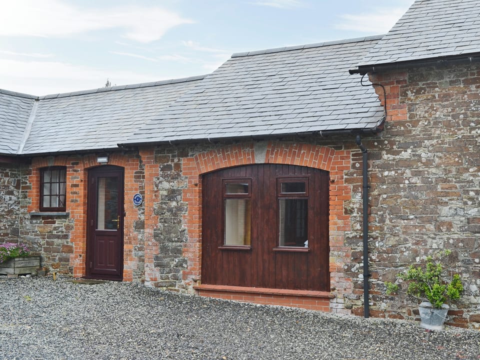 Front entrance from the gravelled courtyard | Warren Cottage - Stowford Lodge Holiday Cottages, Langtree, near Great Torrington