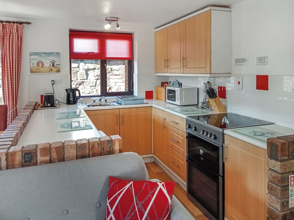 Fully-appointed kitchen area | Tarquol Cottage - Stowford Lodge Holiday Cottages, Langtree, near Great Torrington
