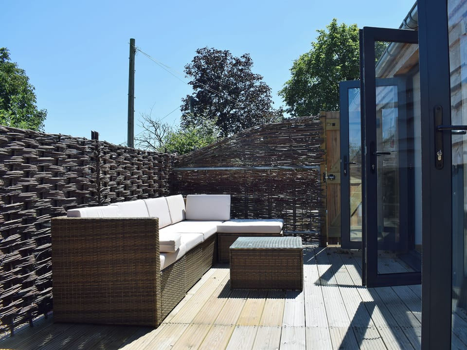 Peaceful decked courtyard | Dornfelder - Rossiter&rsquo;s Vineyard Barn, Wellow, near Yarmouth