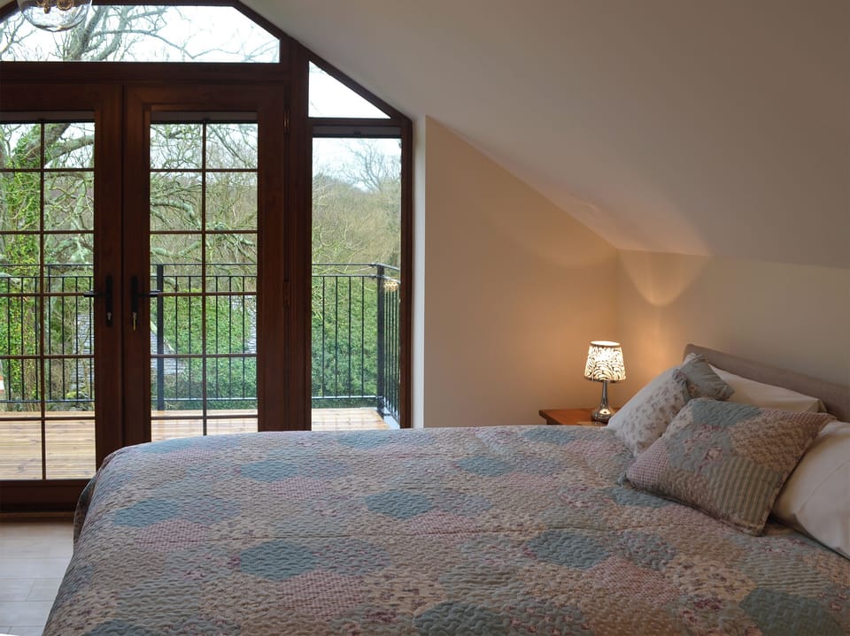 Double bedroom with balcony | Stabal Arthur - Trehwfa Cottages, Bodedern, near Holyhead