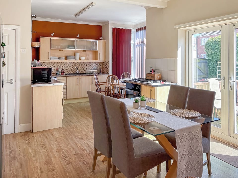 Kitchen opening on to the decking area and garden | Lilac Villa, Skegness