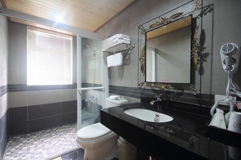 Deluxe Quadruple Room, Terrace | Bathroom | Shower, slippers, towels