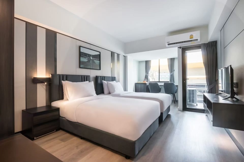 Deluxe Twin Room, 2 Twin Beds | Desk, laptop workspace, soundproofing, free WiFi