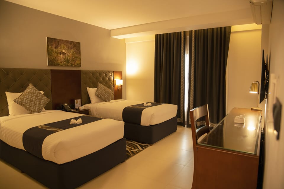 Standard Twin Room | In-room safe, desk, laptop workspace, blackout drapes