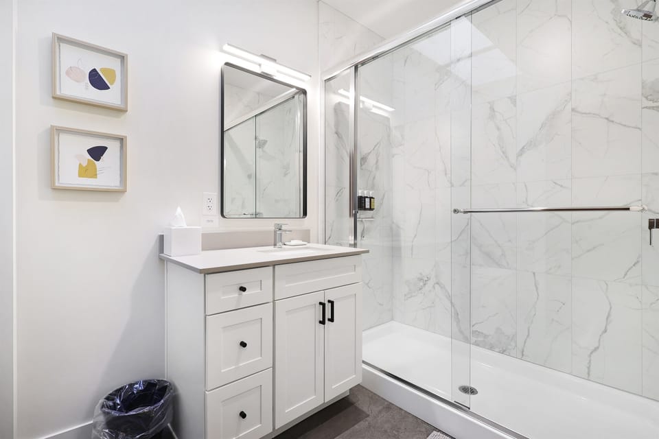 Super clean & modern bathroom with walk in tile shower