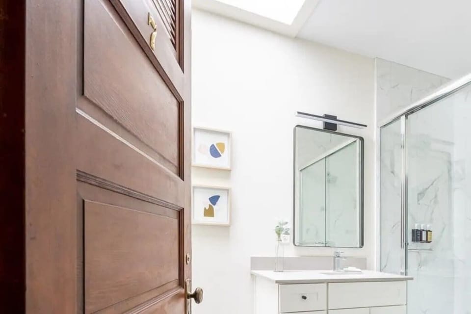 Well lit bathroom with skylight
