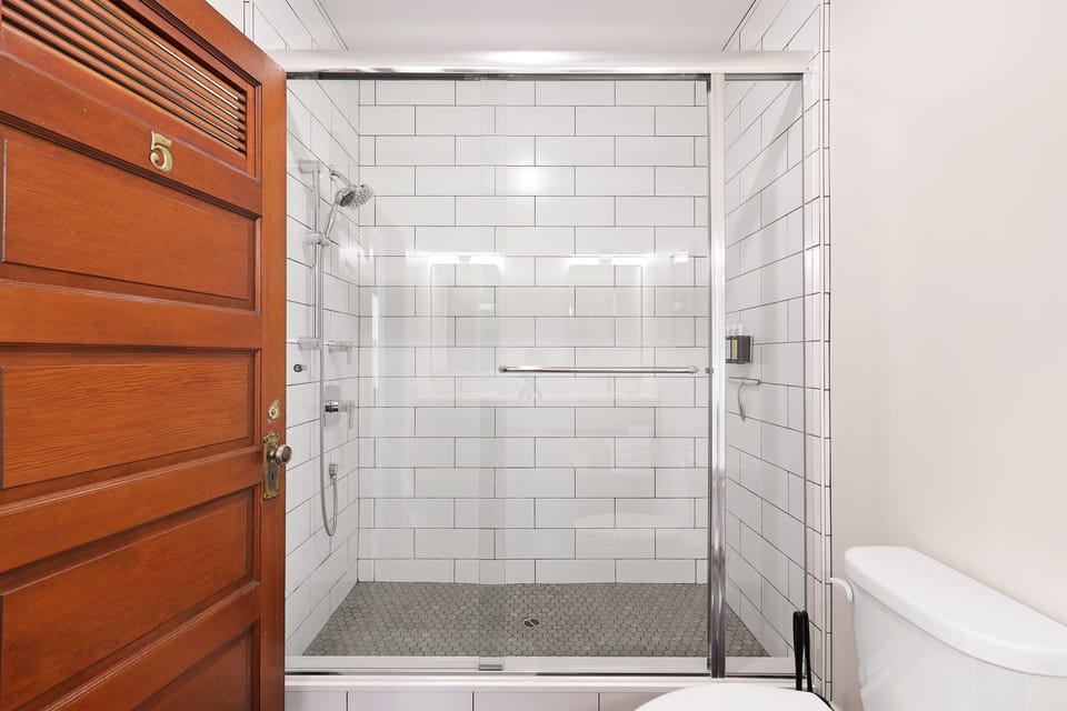 Custom tile walk-in shower with upscale Guild & Pepper shampoo, conditioner & body wash made from natural ingredients & essential oils (our products do not contain parabens, phthalates, petrol-derived ingredients or mineral oil).