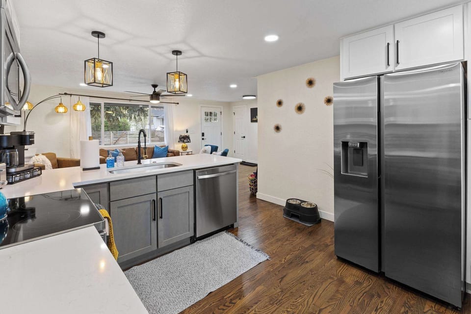The kitchen is stocked with utensils, cookware and spices.
