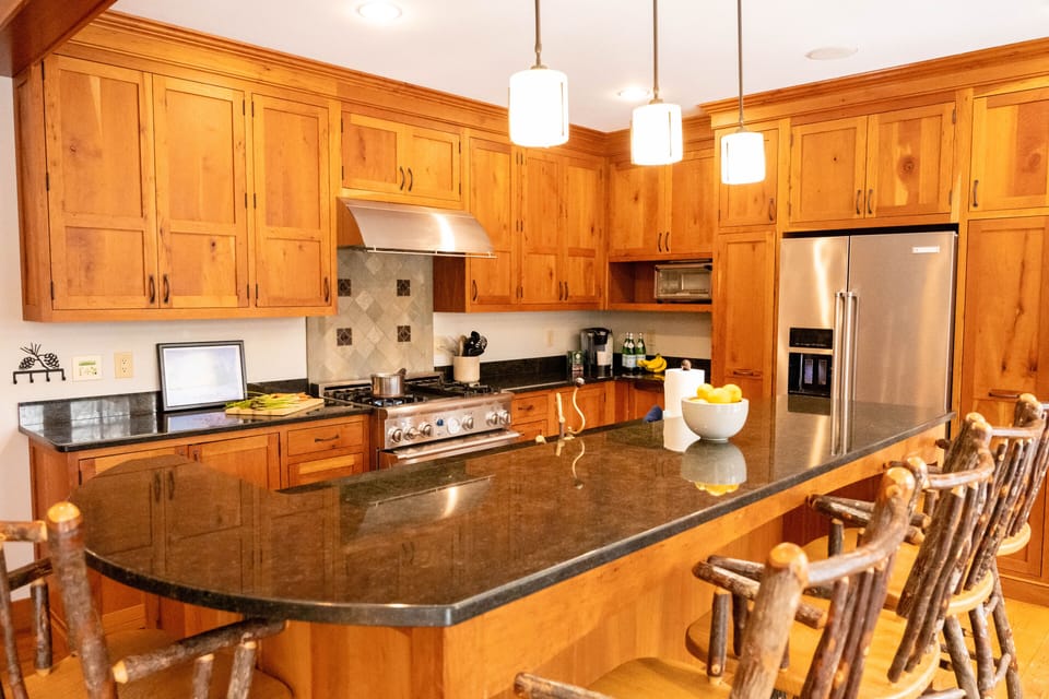 Rustic custom cabinetry and counter stools 
