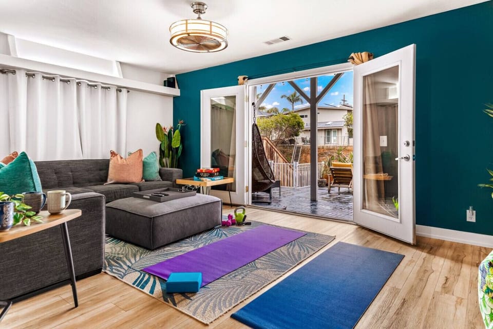 The family room provides a great place to kick back. Open the french doors to the back patio and hear the birds sing while you practice some yoga followed by a soak in the spa, or gather the family for some board games!
