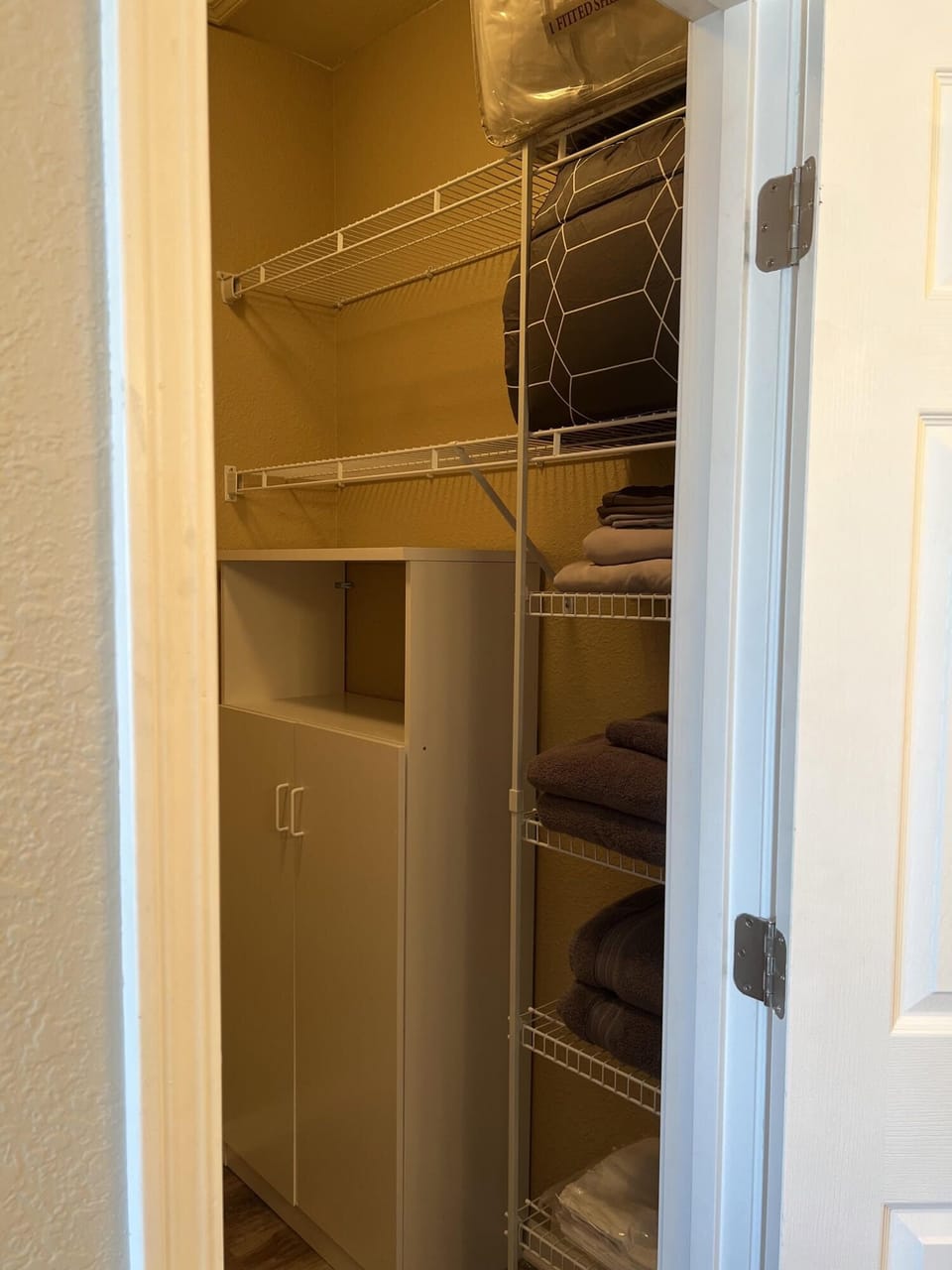 Another view of the primary suite walk-in closet. 
