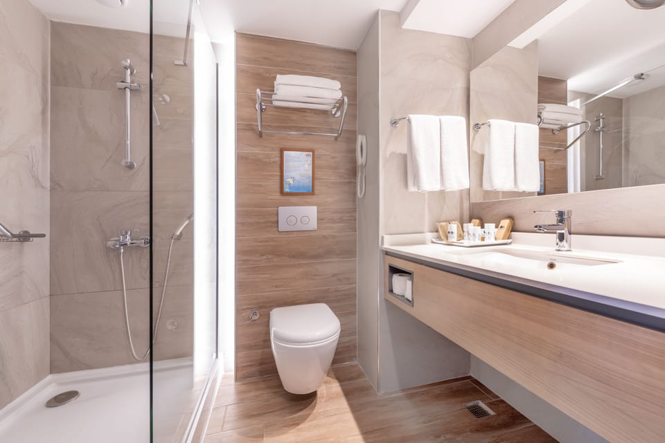 Deep soaking tub, hair dryer, slippers, towels