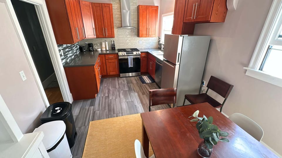 A functional kitchen with space to cook, eat, or sip your morning coffee by the window.