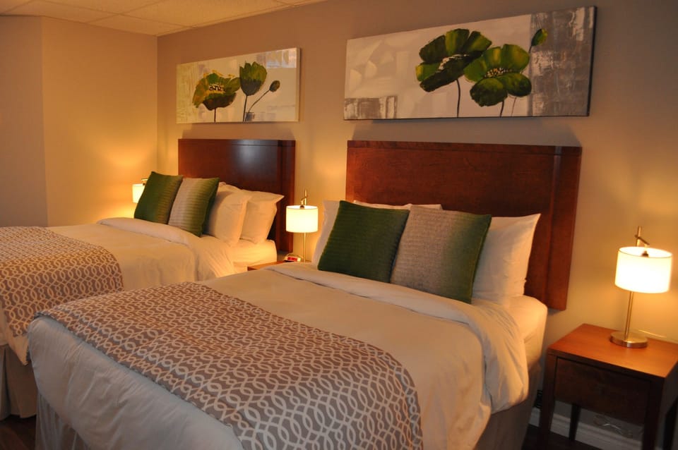 Comfort Room, 2 Double Beds | Individually decorated, desk, blackout drapes, iron/ironing board