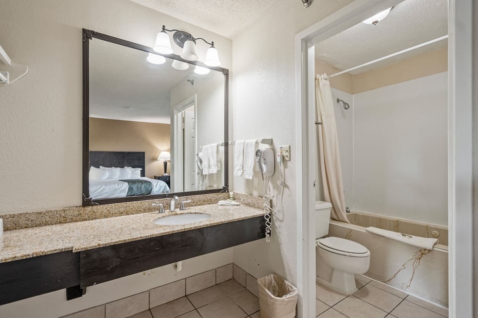 Combined shower/tub, designer toiletries, hair dryer, bathrobes