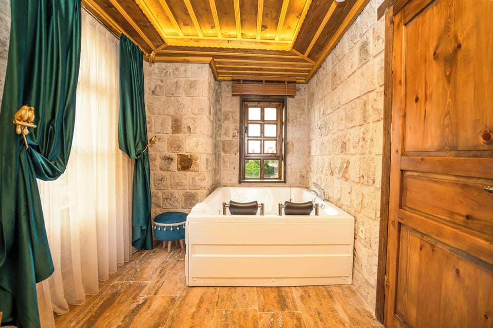 Premium Suite, Jetted Tub | In-room safe, laptop workspace, blackout drapes, soundproofing