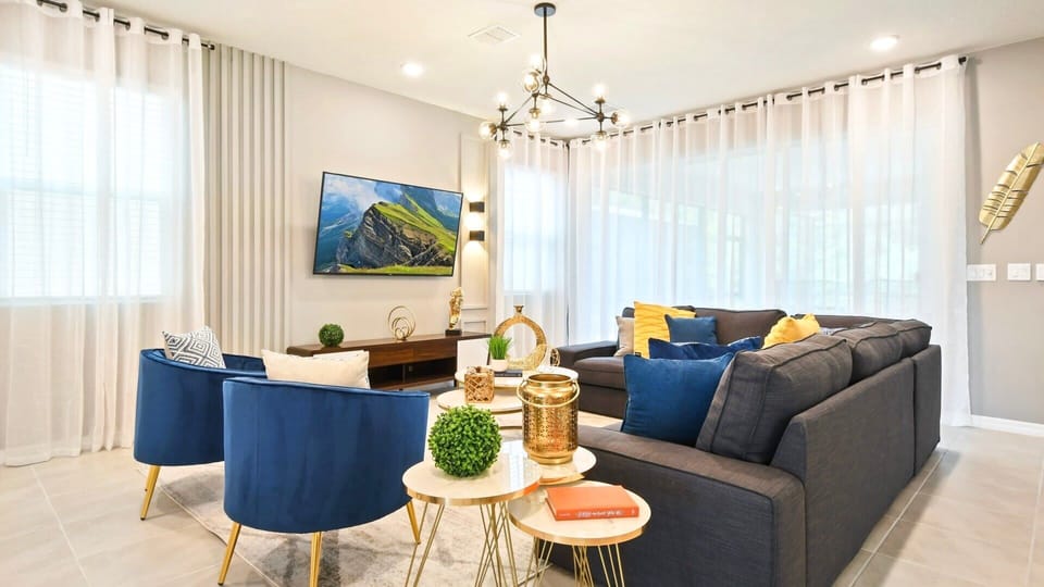 Living Room: Spacious and inviting, the area features a cozy sofa.